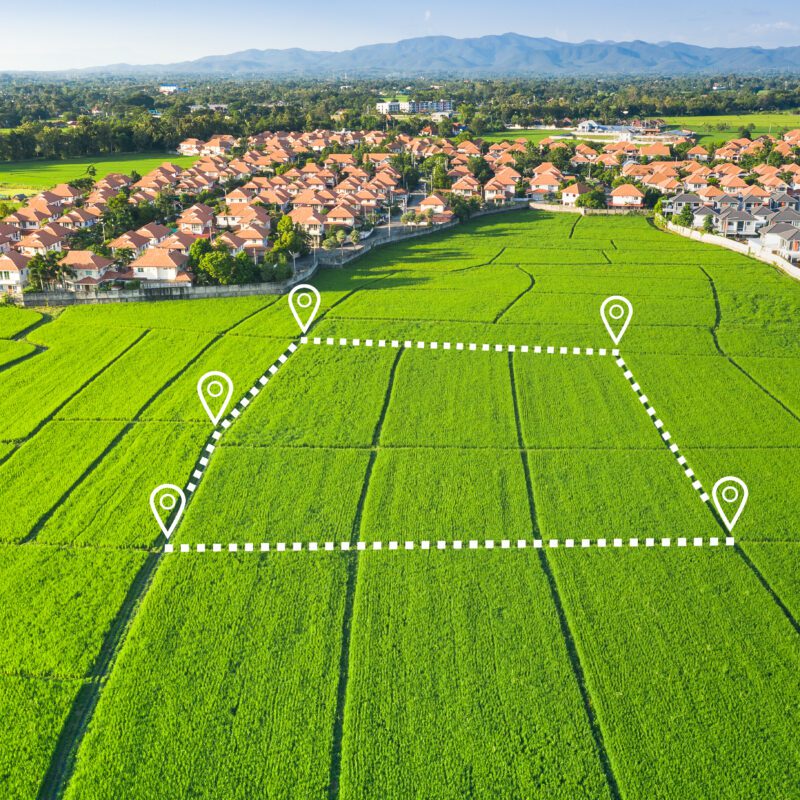 Land plot in aerial view. Identify registration symbol of vacant area for map. That property, real estate for business of home, house or residential i.e. construction, development, sale, rent and buy.